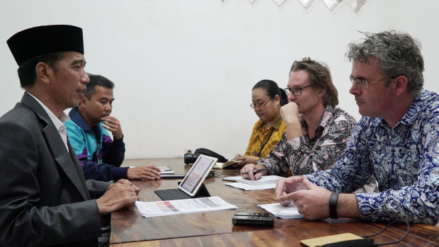 Our reporters James Massola, right, and Amilia Rosa (third from right) interview President Joko Widodo, left, with the Australian Financial Review's Angus Grigg (second from right) in March 2018.