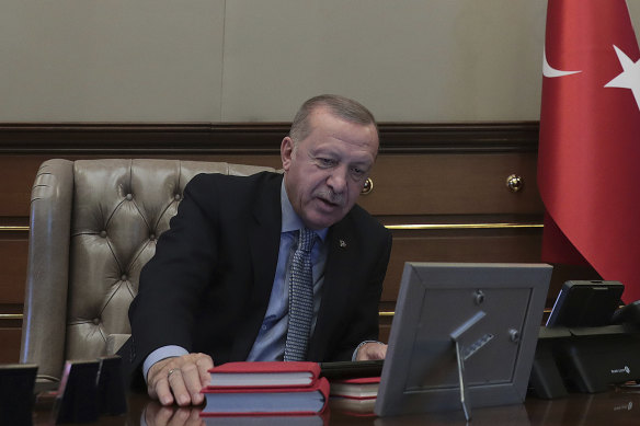 A photograph released to Turkish media showed Erdogan at his desk, reportedly giving orders for the start of the operation.

