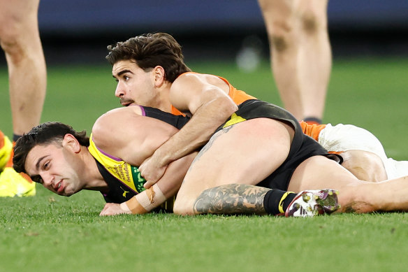 Richmond’s Tim Taranto is tackled by the Giants’ Toby Bedford.