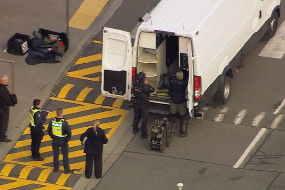 The bomb squad preparing to enter Avalon Airport, where a man was detained after a suspicious package was found in his luggage.