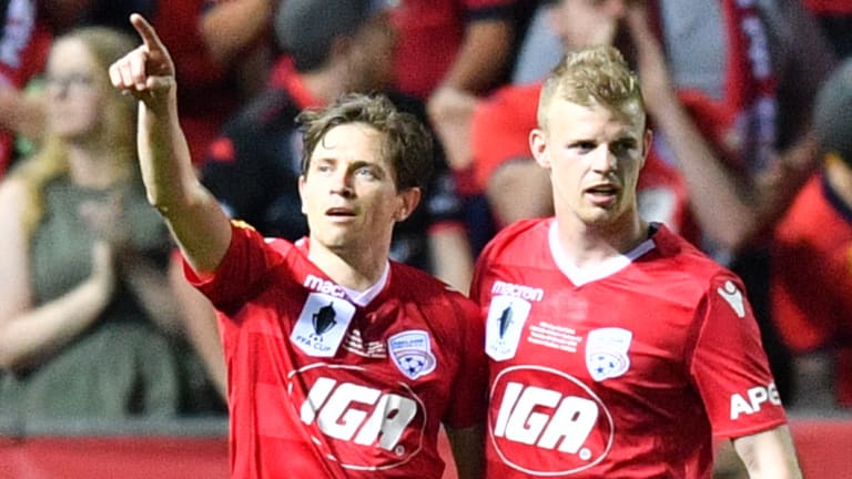 Hometown hero: Craig Goodwin celebrates with Jordan Elsey after his second strike.