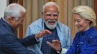 Indian Prime Minister Narendra Modi, center, welcomes European Council President Antonio Costa, left and European Commission President Ursula von der Leyen in New Delhi.