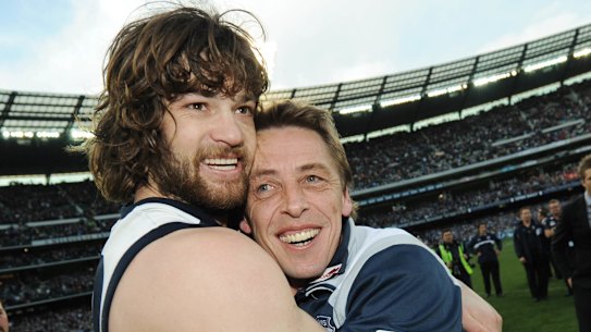 Max Rooke and former Cats coach Mark Thompson after the 2009 AFL grand final.