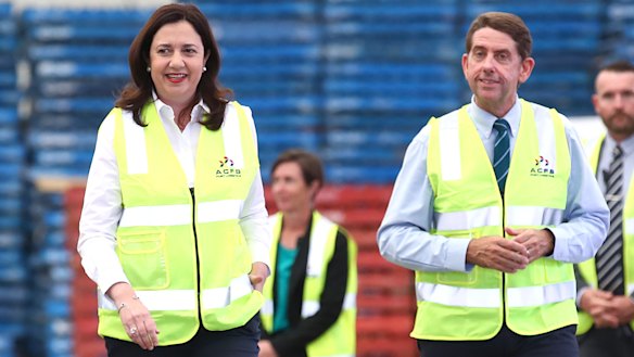 Premier Annastacia Palaszczuk (left) with Treasurer Cameron Dick (right) at an oil refinery near Gladstone on Wednesday.