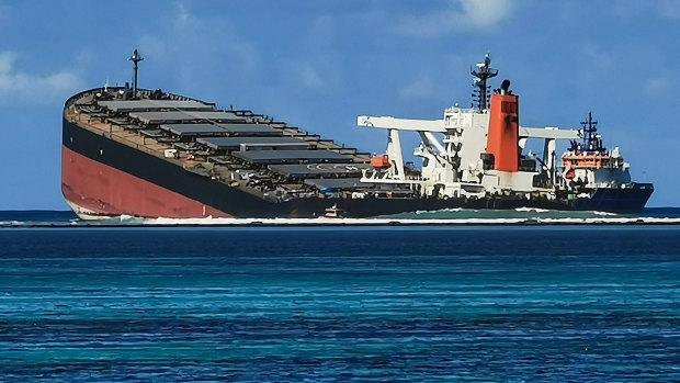 The MV Wakashio bulk carrier vessel sits partially submerged in the ocean after running aground close to Pointe d'Esny, Mauritius.