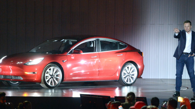 Tesla CEO Elon Musk at the launch of the Tesla Model 3. The Model 3 has put pressure on VW’s best selling Golf.
