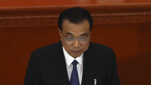 Chinese Premier Li Keqiang delivers the government work report during the opening session of China's National People's Congress.