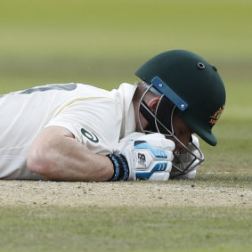 Steve Smith lies on the ground after being hit on the head by a ball bowled by England's Jofra Archer. 