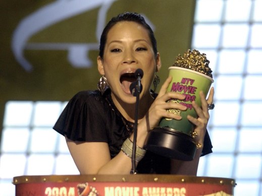 Liu celebrates her Best Villain Award for her role as O-Ren Ishii in Kill Bill at the 2004 MTV Movie Awards.