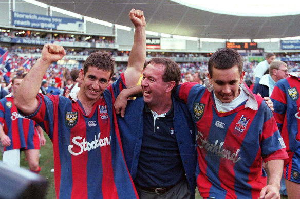 Andrew and Matthew Johns with their father Gary after the 1997 grand final.