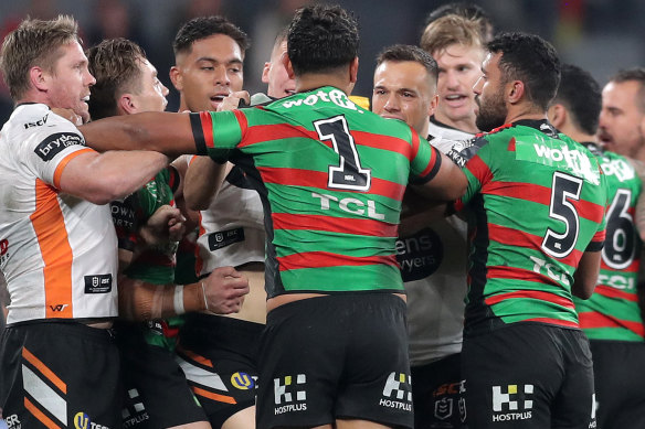 The Rabbitohs and Tigers match erupted early on after Josh Reynolds was put on report for dangerous tackle.