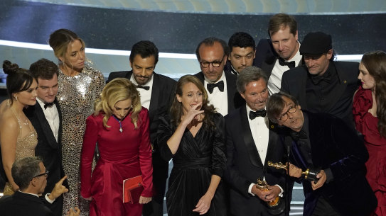 The cast and crew of CODA accept the award for best picture at the Oscars.
