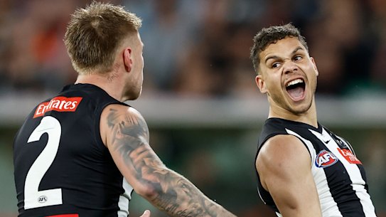 Jordan De Goey (left) and Bobby Hill of the Magpies celebrate.
