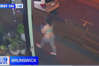 Video Grab of CCTV footage of a woman who was arrested on a tram after two men were stabbed to death in Brunswick.