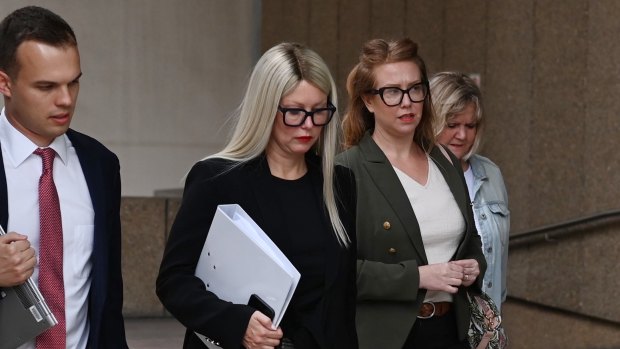 Elaine Stead, centre, and her sister Olivia, right, outside the Federal Court in Sydney on Wednesday.