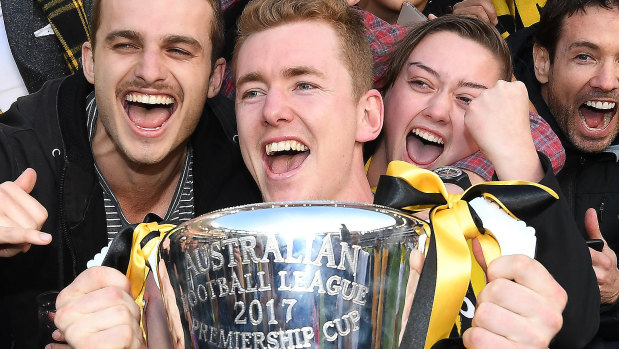 Jacob Townsend (middle) celebrates the 2017 grand final victory. 