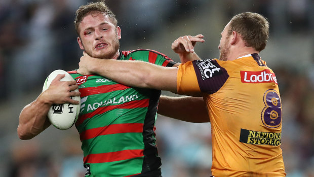 Trading places? George Burgess comes to grips with off-contract Bronco Matt Lodge.