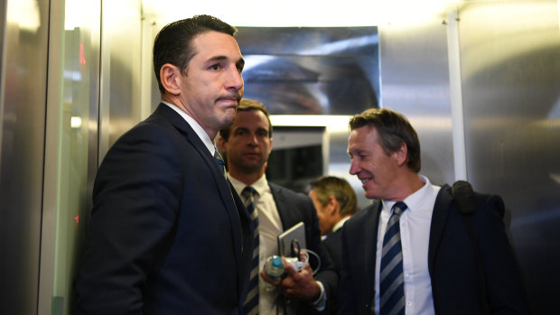 Two faces: Billy Slater looks relieved while coach Craig Bellamy appears delighted to have his star fullback available.