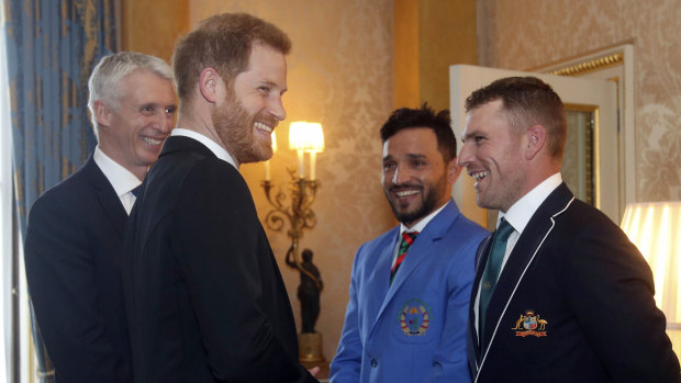 Well bowled: Aaron Finch reacts after a cheeky comment from Prince Harry.