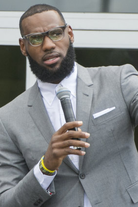 Voice for unity: LeBron James speaks at the opening ceremony for the I Promise School in Akron, Ohio.