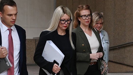 Elaine Stead, centre, and her sister Olivia, right, outside the Federal Court in Sydney on Wednesday.