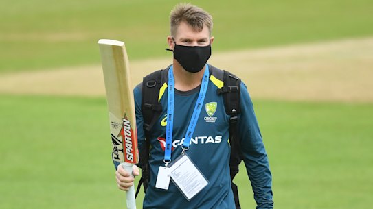 The new normal: David Warner wears a mask during a net session in Southampton. 