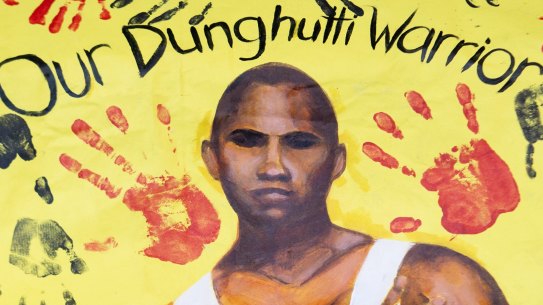 A banner of David Dungay Junior placed outside court during the inquest into his death.