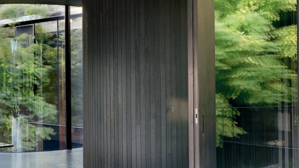 The curved timber walls create an opportunity to peer beyond.