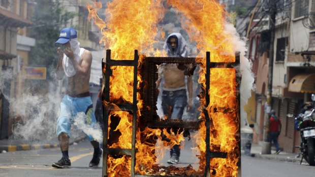 Demonstrators block a street during a protest demanding the resignation of President Juan Orlando Hernandez, in Tegucigalpa, Honduras, on Septermber 15.