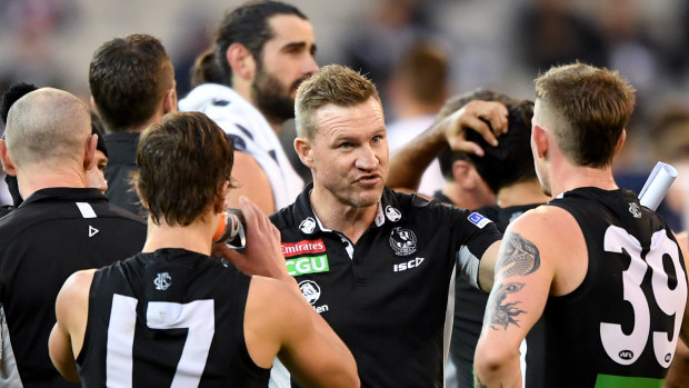 Testing times: Collingwood coach Nathan Buckley was had to deal with the loss of Darcy Moore and Tom Phillips during their round 8 defeat to Geelong.
