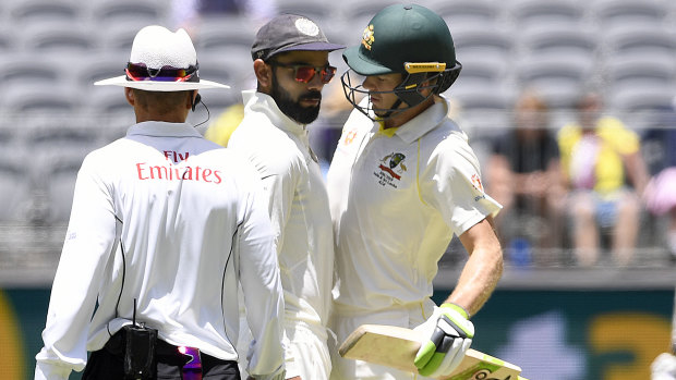 Clash: Virat Kohli and Tim Paine exchange words.