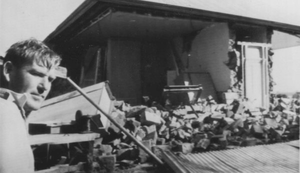 Farmer Peter Kelly inspects his ruined home. 