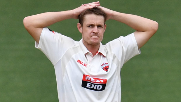 Headache: Joe Mennie, pictured here for South Australia, was subbed from the field after being hit in the head during his follow through while bowling.