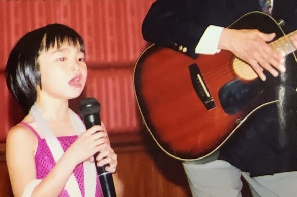 Kimberley Chen as a child singing in Melbourne. 