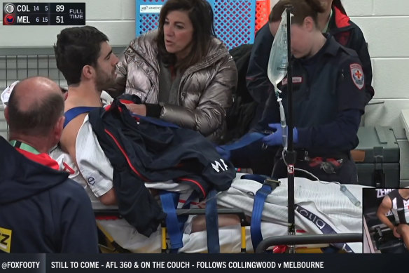 Christian Petracca is comforted by his mother Elvira after he was injured.