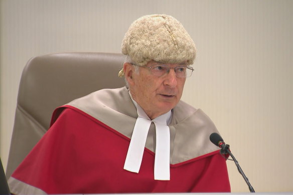 Justice Ian Harrison delivering his verdict in the Chris Dawson murder trial in August 2022.