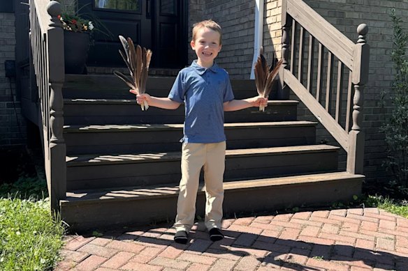 Five-year-old Sam Parkinson with the goose feathers he had collected from the pond.