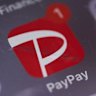 The PayPay app icon on a smartphone in Tokyo, 