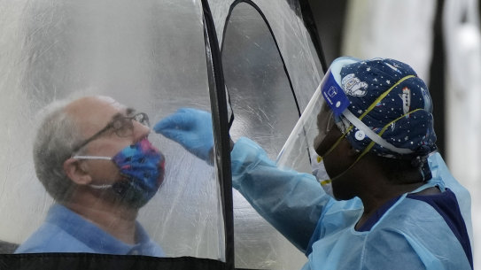 A man is tested for COVID-19 in downtown Miami this week.