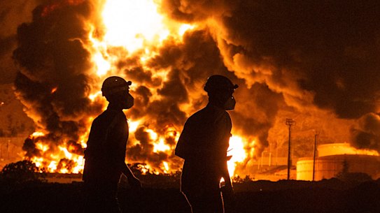 An oil storage facility burns after being hit by Israeli airstrikes in Tehran, Iran, on Sunday.