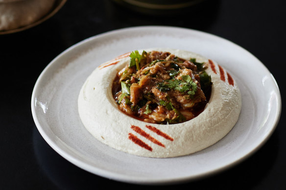 Tom Sarafian's signature hummus topped with shrimp and crab.