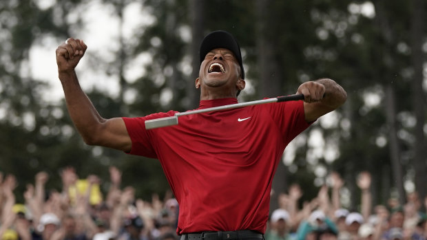 Tiger Woods celebrates his fifth Masters title and first major in 11 years.