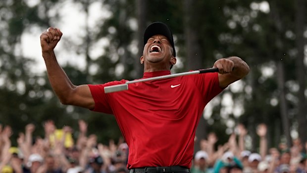 Tiger Woods celebrates his fifth Masters title and first major in 11 years.