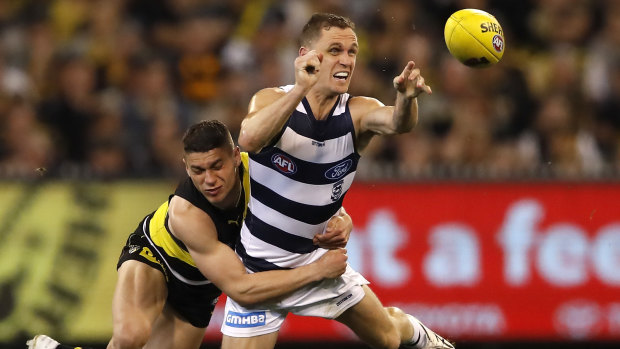 Crunch time: Joel Selwood is tackled by Tiger Dion Prestia during last year's preliminary final against Richmond.