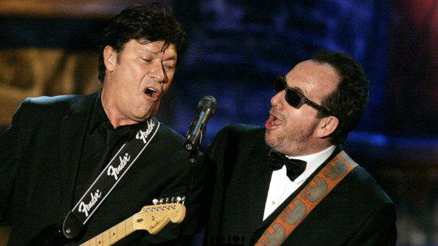 Robbie Robertson and Elvis Costello perform together in 2006.