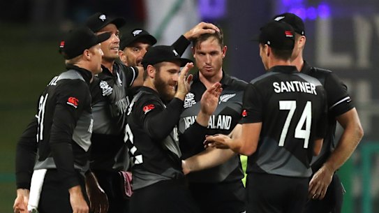 New Zealand’s bowler Adam Milne, third from right, celebrates with teammates after dismissing England’s batsman Jonny Bairstow for 13 runs during the Cricket Twenty20 World Cup semi-final match between England and New Zealand in Abu Dhabi, UAE, Wednesday, Nov. 10, 2021. (AP Photo/Kamran Jebreili)