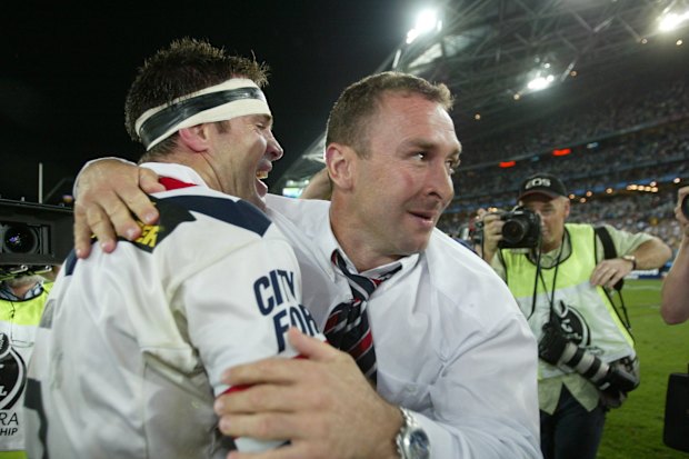 Ricky Stuart celebrates with Brad Fittler after winning a title in 2002.