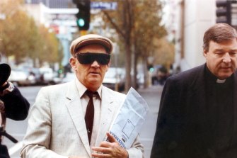 Gerald Ridsdale outside court in 1993, accompanied by George Pell.