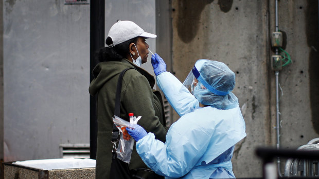 Test, test, test ... in New York, a city and state under siege, a patient is given a COVID-19 test outside Brooklyn Hospital Centre.