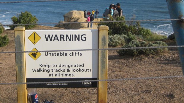 Tourists put their lives at risk by ignoring
warning signs on unstable cliffs at the world-acclaimed Twelve Apostles coastal icon.
